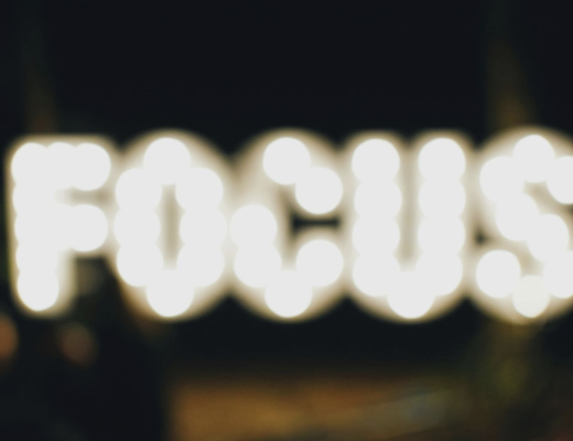 The Word Focus Spelled In Blurry Lights